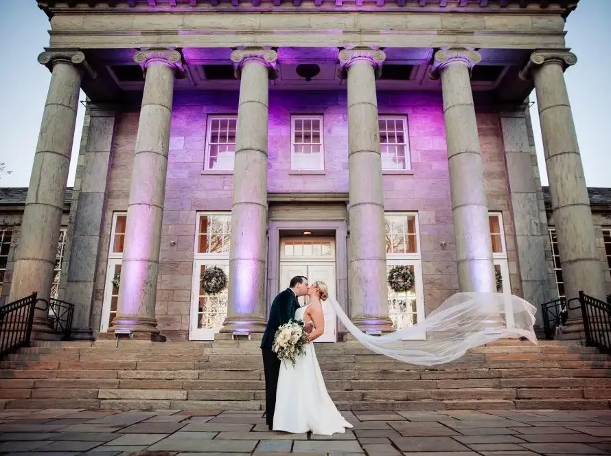 Newlyweds outside Ballroom at Ellis Preserve wedding venue in Newtown Square Pennsylvania