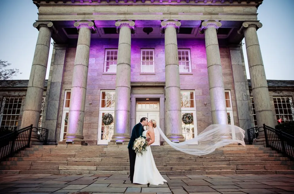 Newlyweds outside Ballroom at Ellis Preserve wedding venue in Newtown Square Pennsylvania