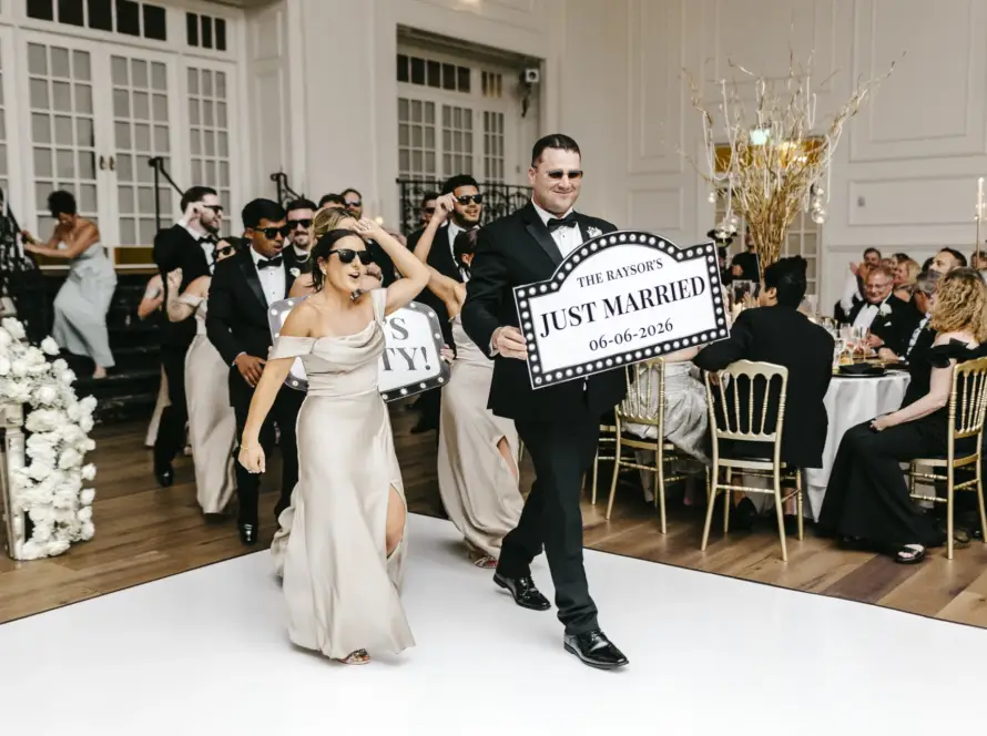 Wedding party grand entrance with a Just Married sign at Cescaphe Ballroom in Philadelphia