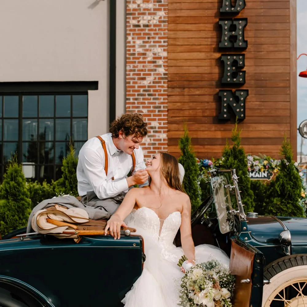 Bride and groom on a vintage truck at MudHen Brewery in Wildwood, NJ
