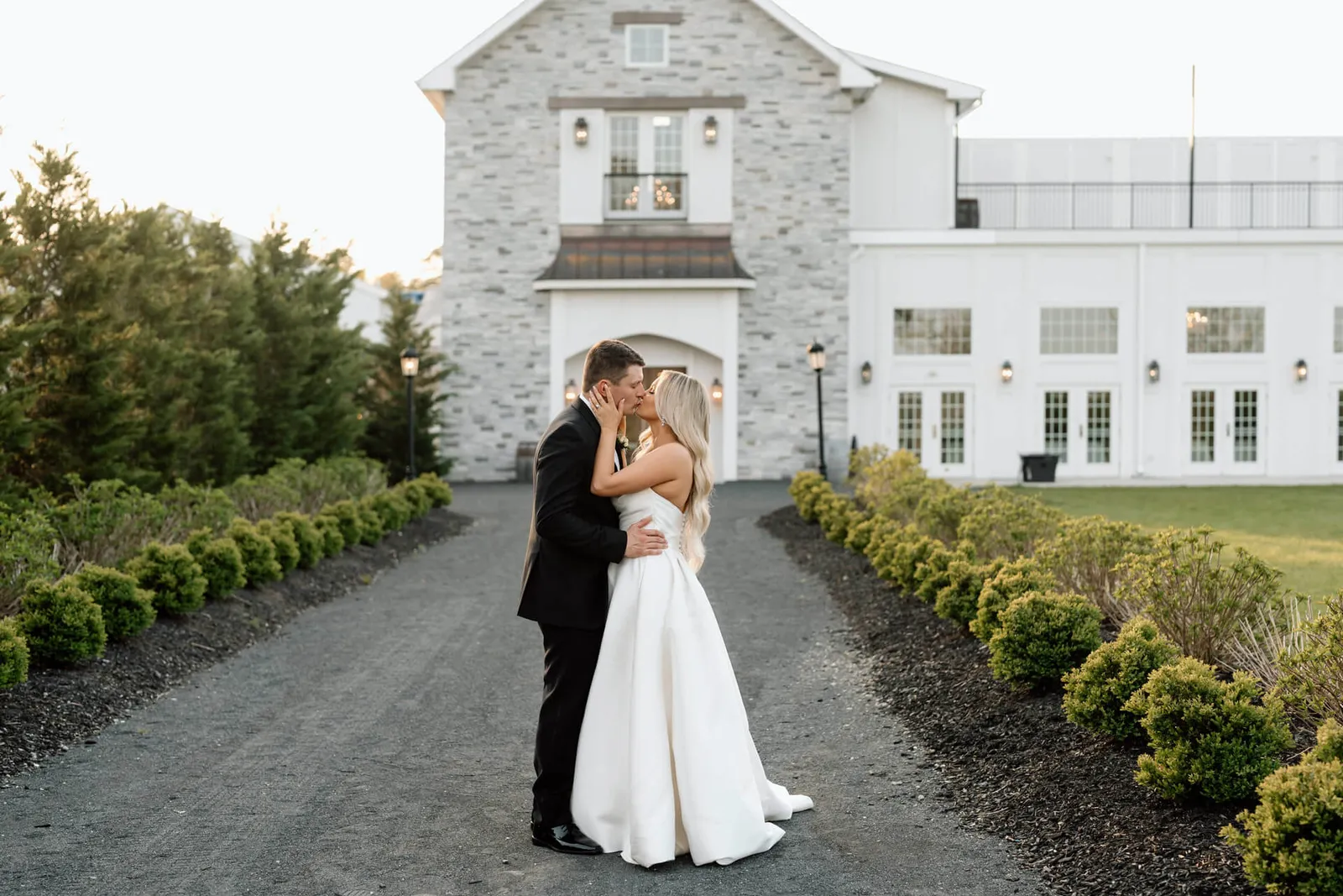 Bride and groom on the garden walkway at Renault Winery in South Jersey