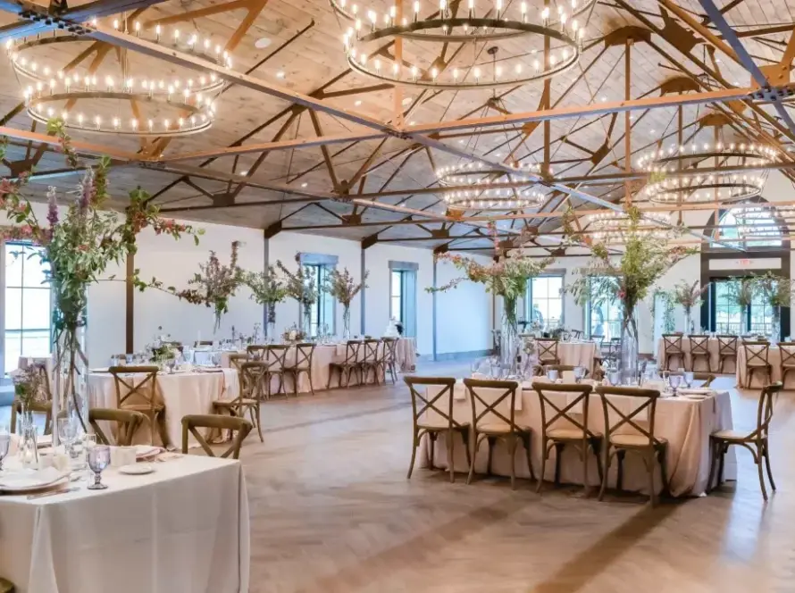 Wedding reception ballroom with exposed beams and chandeliers at Renault Winery in Egg Harbor City, NJ